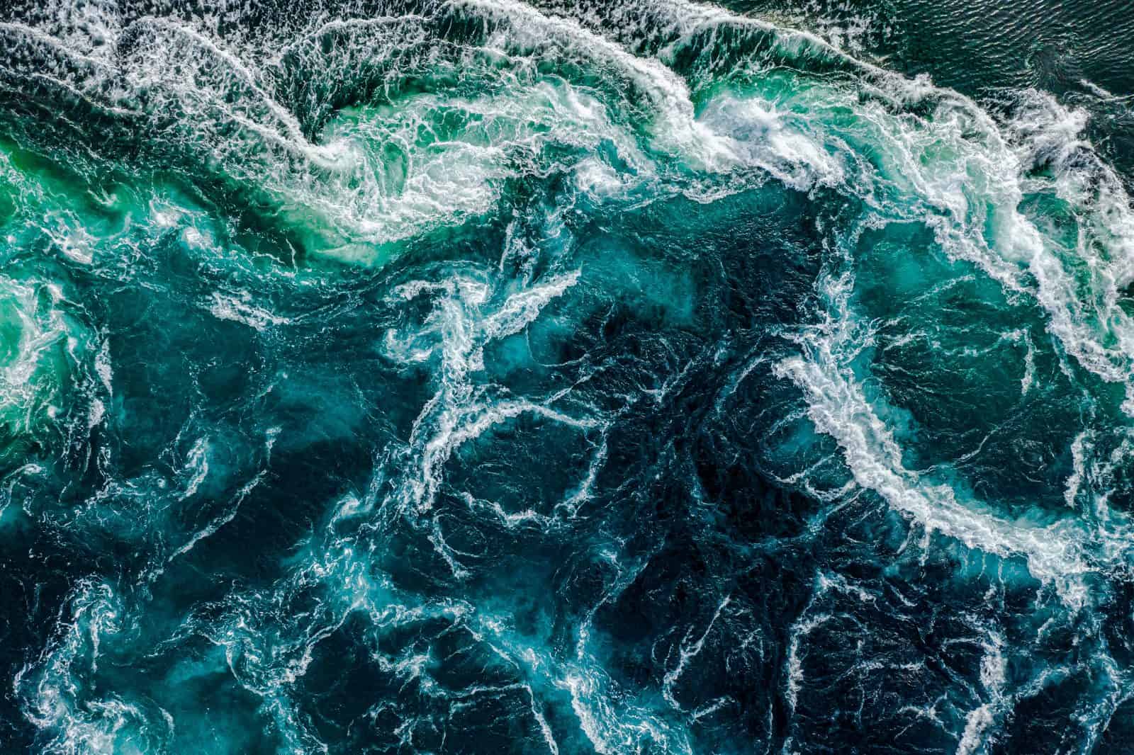 Abstract background Waves of water of the river and the sea mee