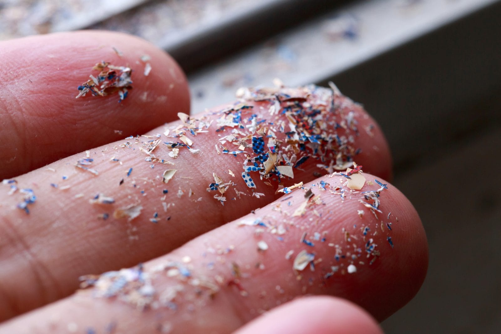 PetroStrat Microplastic example on fingertips